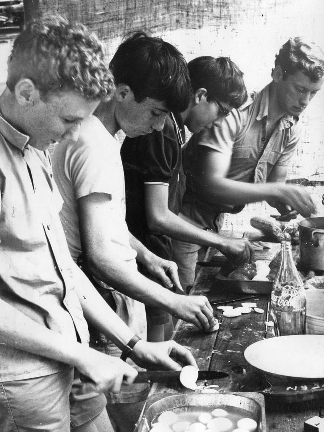 Boy Scouts at the 1966 Australian Corroboree at Woodhouse in the Adelaide Hills. Here David Ranford, Grant Venus, Jan Tagell and John Chester from Group K, Troop 1 (Mitcham and Unley Districts) prepare their midday meal in their ‘kitchen’.