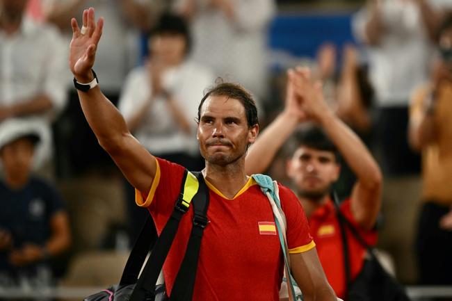 Thanks for the memories: Rafael Nadal waves goodbye to the crowd after defeat in the Paris Olympics men's doubles quarter-finals alongside Carlos Alcaraz