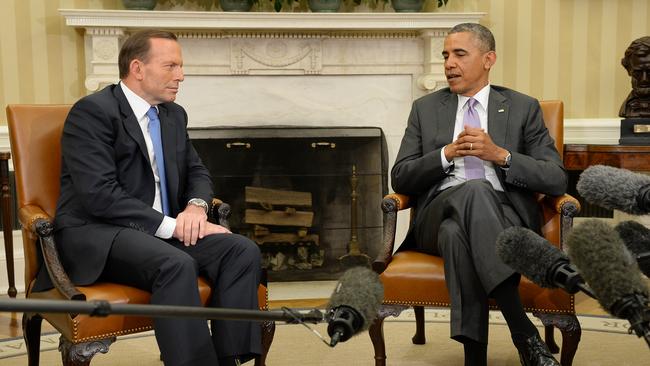 Getting down to business ... Australian Prime Minister Tony Abbott meets with President Obama in the Oval Office of The White House. Picture: Jake Nowakowski