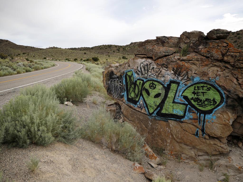 Alien-themed graffiti adorns a rock along the Extraterrestrial Highway, near Rachel, Nevada. Picture: AP/John Locher