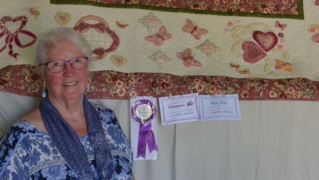 Lynette Christian stands with her patchwork creation which won champion quilt honours at this year's Charters Towers show. Photo: JACOBBE McBRIDE