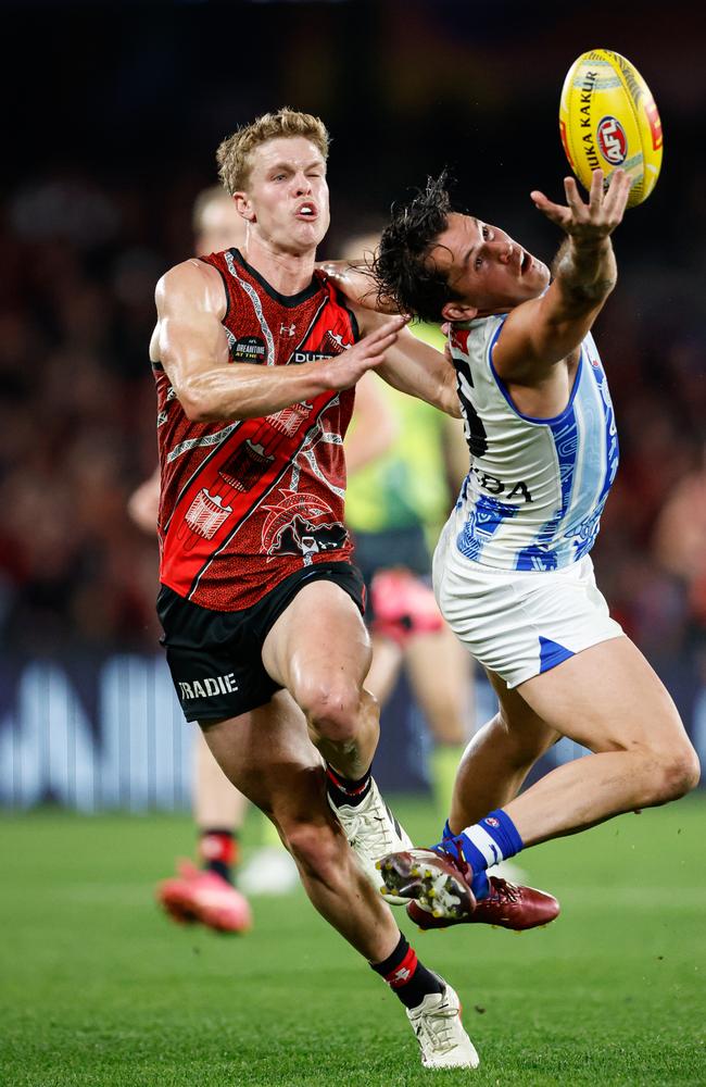 Curtis Taylor and Ben Hobbs compete for the ball at Marvel Stadium. Picture: Dylan Burns/AFL Photos via Getty Images.