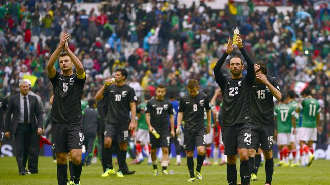 New Zealand players leave the pitch after losing 5-1 to Mexico