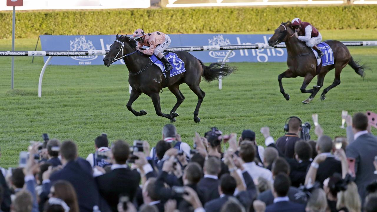 CORRECTS SPELLING OF THE JOCKEY'S FAMILY NAME - Black Caviar, left, ridden by Luke Nolen, leads Epaulette, ridden by Kerrin McEvoy, 25 meters from the finishing post in the TJ Smith Stakes at Royal Randwick in Sydney, Australia, Saturday, April 13, 2013. The win gives Black Caviar her 25th consecutive win. (AP Photo/Rick Rycroft)