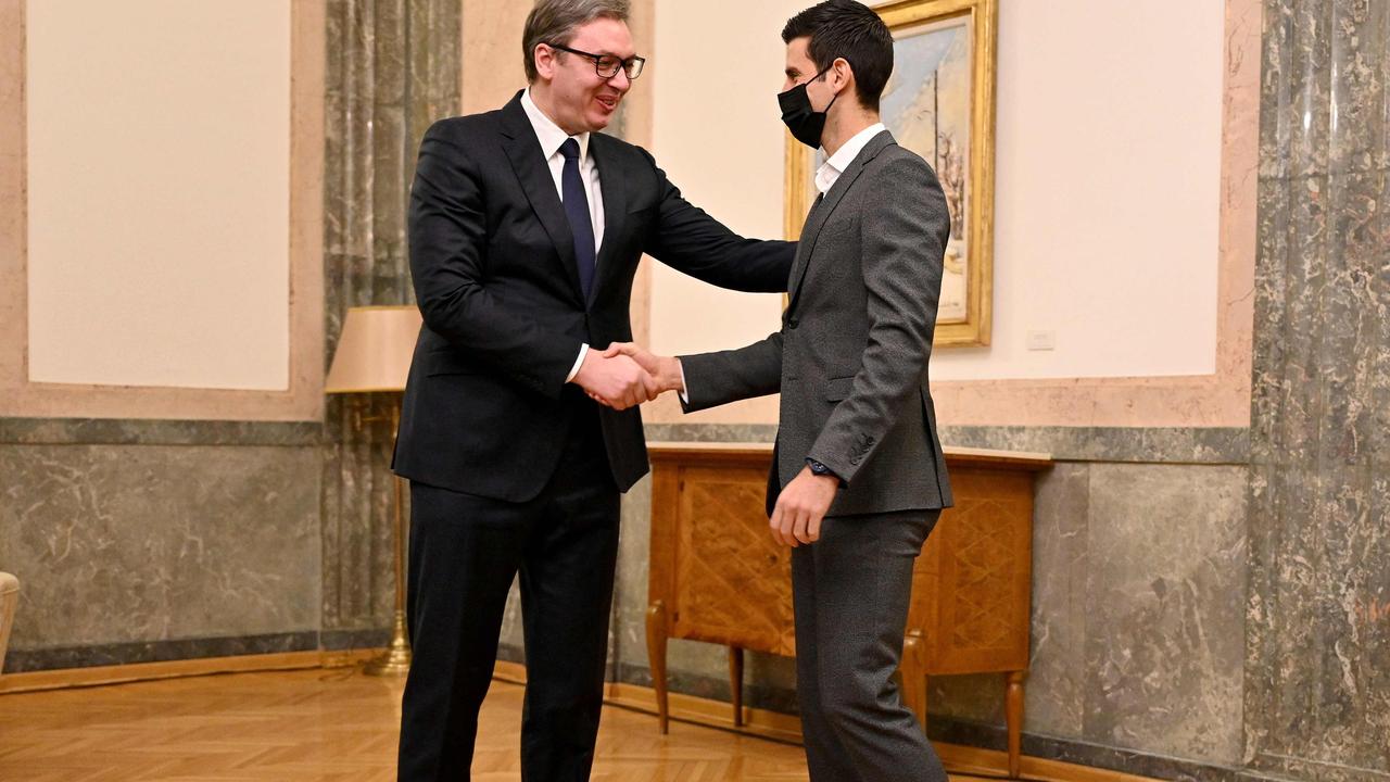 Djokovic, seen wearing a mask, shakes hands with Serbian President Aleksandar Vucic as he arrives for the meeting. Picture: Andrej ISAKOVIC / AFP