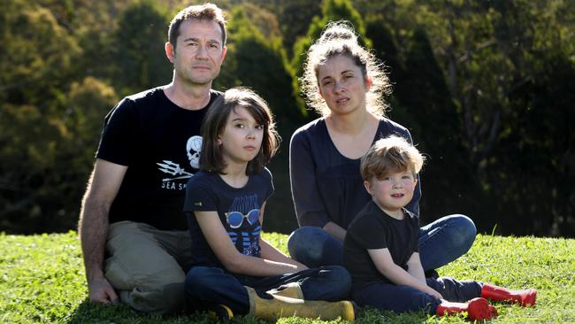 Jean-Philippe Pector with his wife, Julia Malcolm, and their children, Morgane, 9, and Felix, 2 on their property in the Otway Ranges in Victoria. Picture: David Geraghty