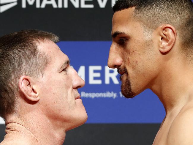 Heavyweight contenders Paul Gallen (L) and Justis Huni weigh in ahead of their bout at Aware Super Theatre in Sydney. Picture: Toby Zerna