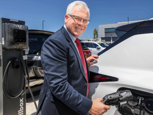 Mitsubishi Motors Australia chief executive officer Shaun Westcott powers up an electric car. Picture: Russell Millard