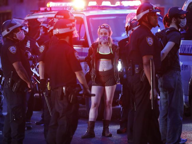 Protesters are arrested by New York Police Department officers on Park Avenue after violating curfew. Picture: AP