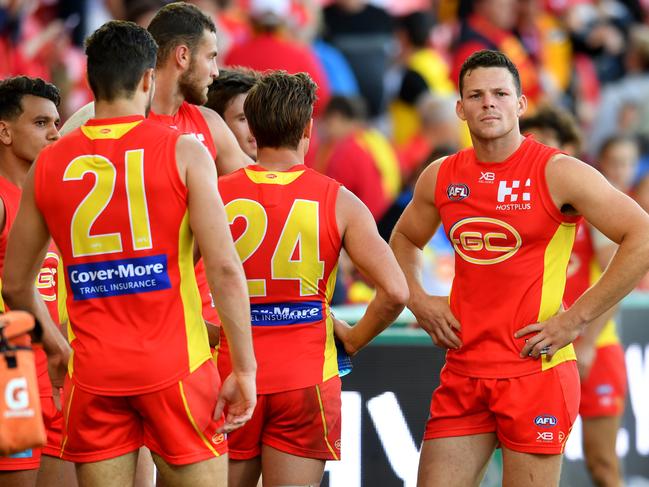 Steven May of the Suns (right) reacts following the Round 21 AFL match between the Gold Coast Suns and the Richmond Tigers at Metricon Stadium on the Gold Coast, Saturday, August 11, 2018. Picture: AAP Image/Darren England