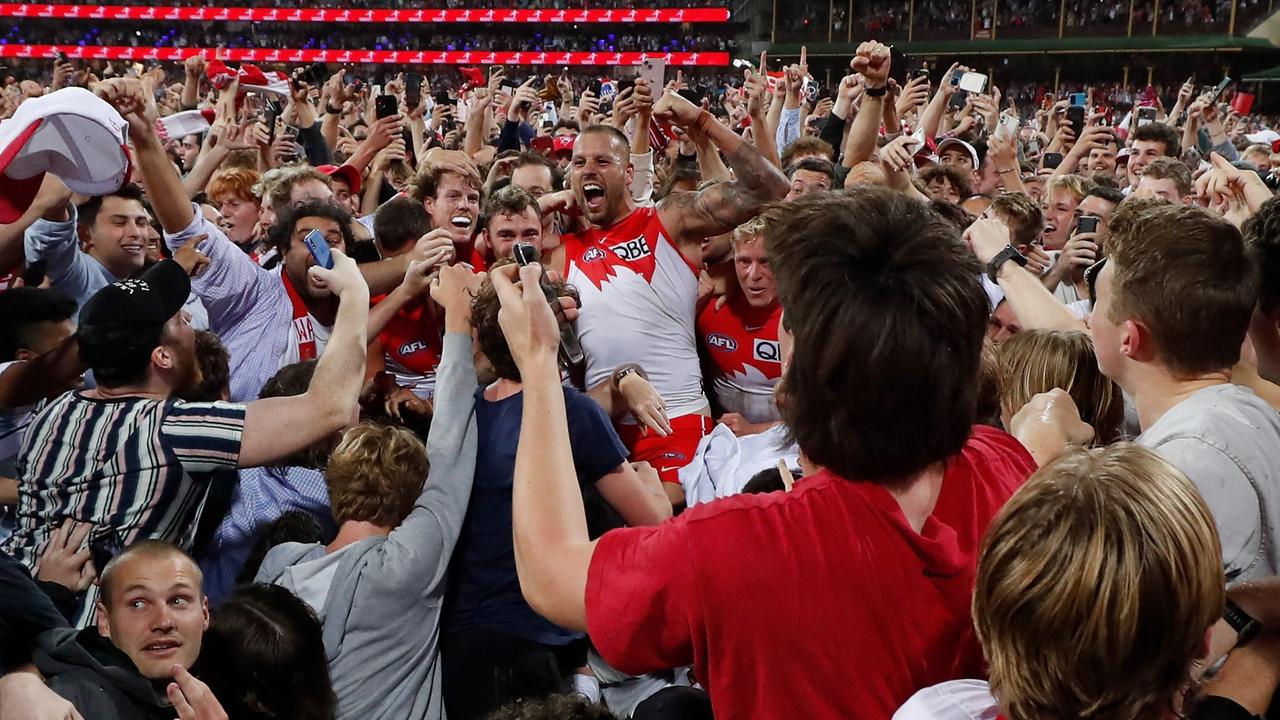 Fans swamped Lance Franklin after he reached the magical 1000.