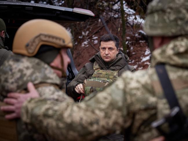 Ukrainian President Volodymyr Zelensky visits combat positions and meets with servicemen at the frontline with Russia-backed separatists in the Donetsk region on the Day of the Armed Forces of Ukraine last December. Picture: Ukrainian presidential press-service / AFP