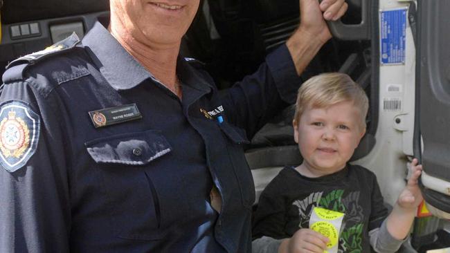 Senior firefighter Wayne Roser with Bailey Smythe at the Botanic Gardens. Picture: Jann Houley