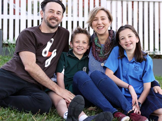 Ronan with his parents Wayne and Amy and his sister Jenaya. He is able to live a healthy life after suffering a stroke as a five-year-old. Picture: Tim Hunter.