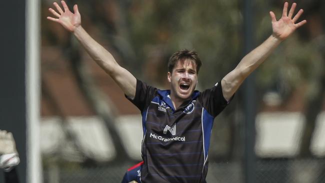 Alexander Gregory claims a wicket for Melbourne University. Picture: Valeriu Campan