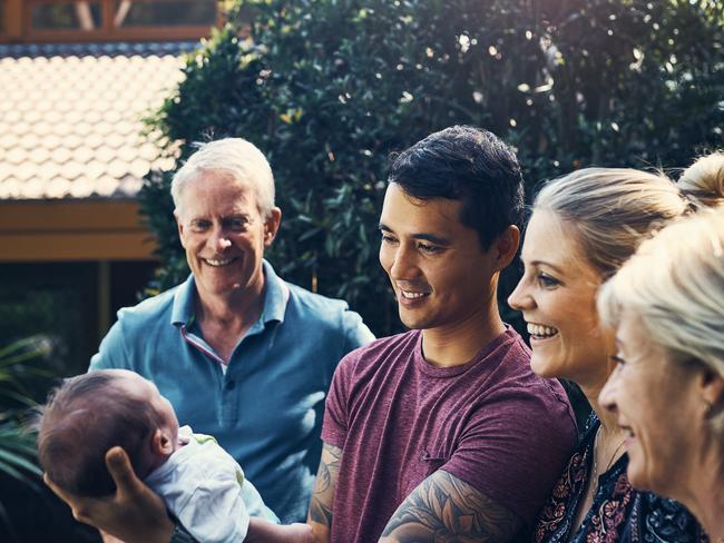 Shot of a young couple introducing their newborn baby son to his grandparents