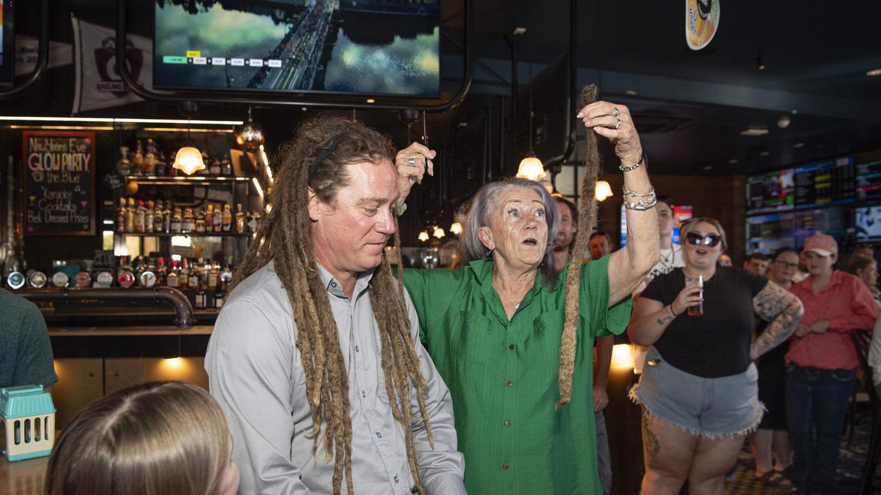 Joel Anderson's mum Vicki Anderson cuts off a dreadlocks in a fundraiser for her granddaughter Charlise Anderson at the Blue Mountain Hotel, Saturday, November 23, 2024. Picture: Kevin Farmer