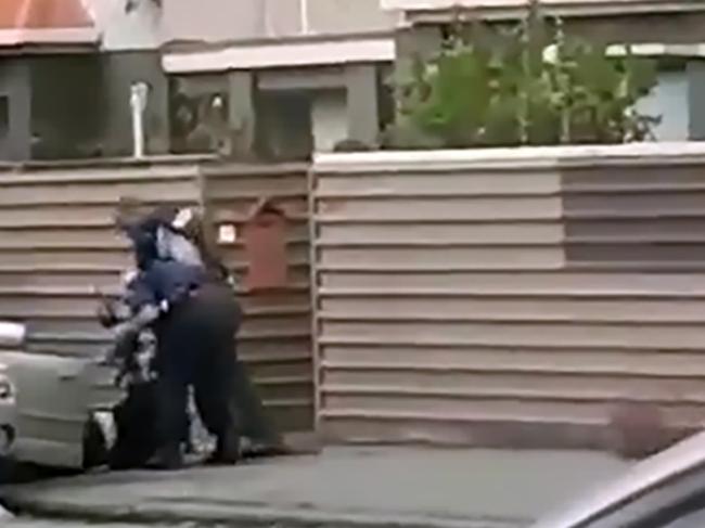 The moment police arrest a man after ramming his car off the road. over the mosque attacks in Christchurch.