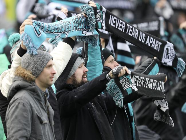 AFL - Port Adelaide v Brisbane Lions at Adelaide Oval. Port fans stand for Never Tear Us Apart. Picture SARAH REED