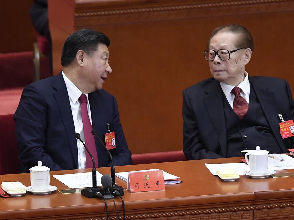 China's former president Jiang Zemin listens to Xi Jinping during the closing of the 19th Communist Party Congress. Picture: AFP