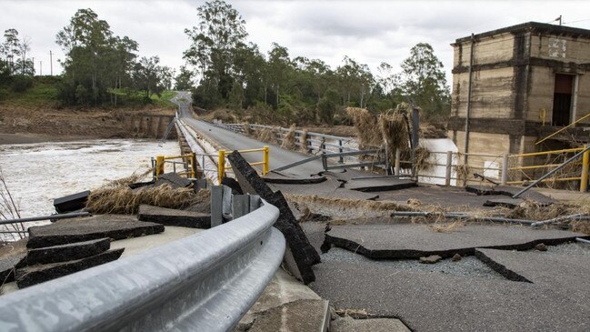 Damage to the Mount Crosby Weir Bridge sustained in February's flood.