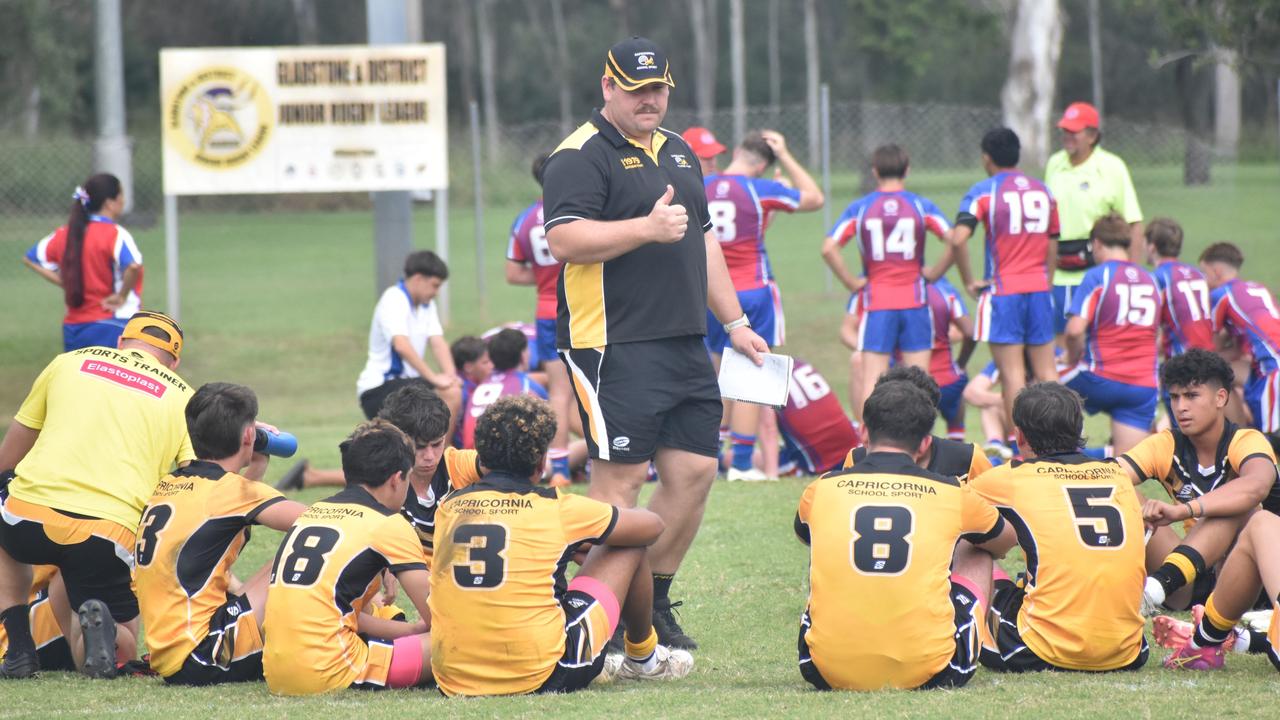 Capricornia 14-15 years coach Lachlan Hall gives a half-time talk to his troops.