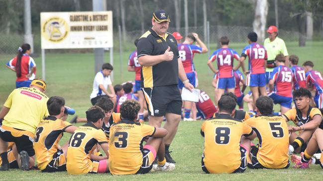 Capricornia 14-15 years coach Lachlan Hall gives a half-time talk to his troops.