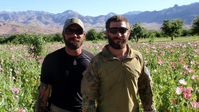 Rudland, left, and Gary Wilson in Afghanistan shortly before the Black Hawk crash.