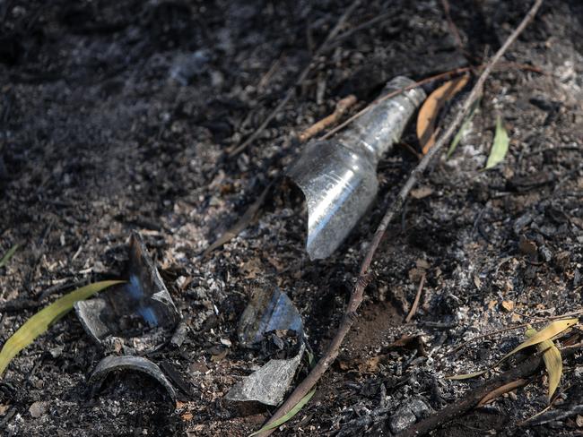 A broken bottle next to the Georges River. Picture: Julian Andrews