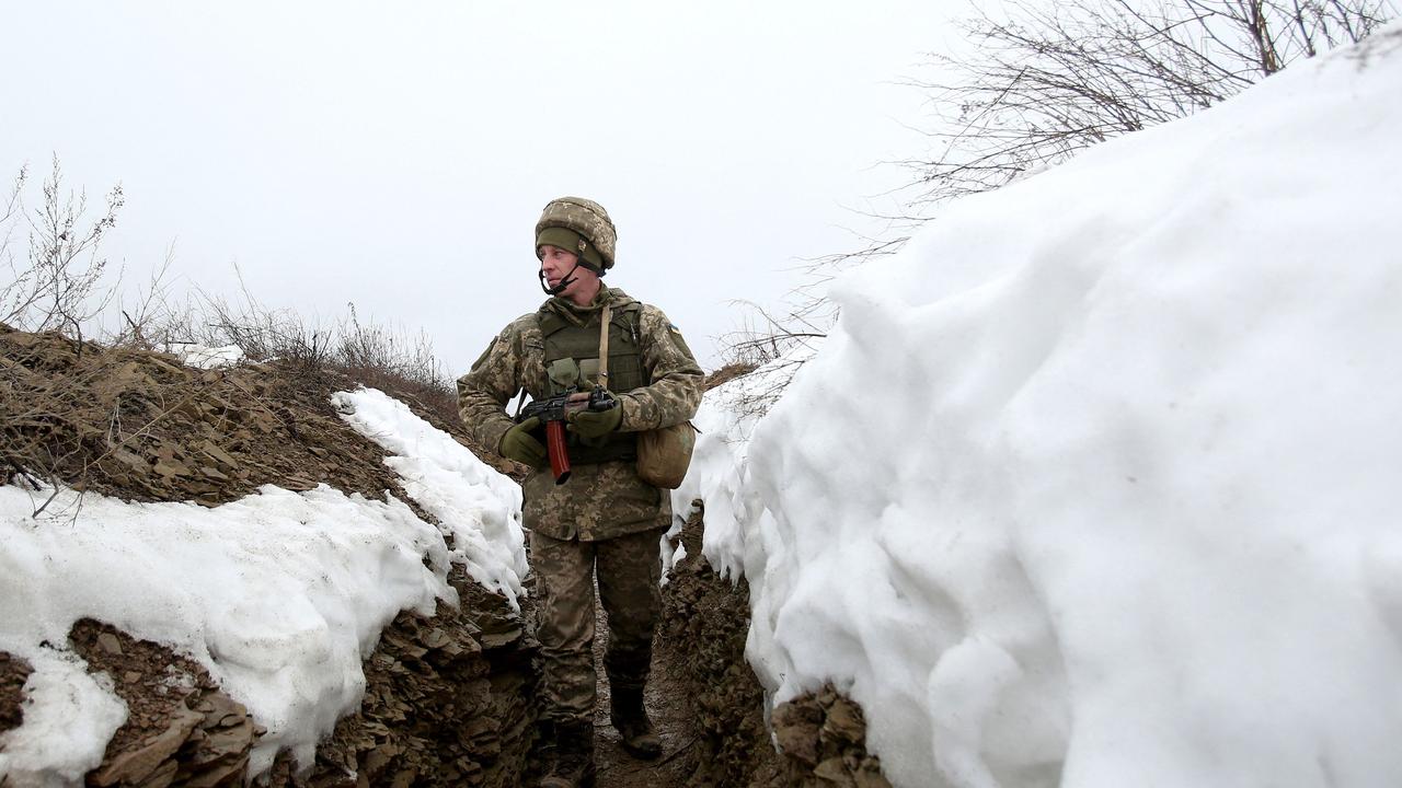 An Ukrainian Military Forces serviceman walks on a trench on the frontline with Russia-backed separatists. Picture: Anatolii Stepanov / AFP