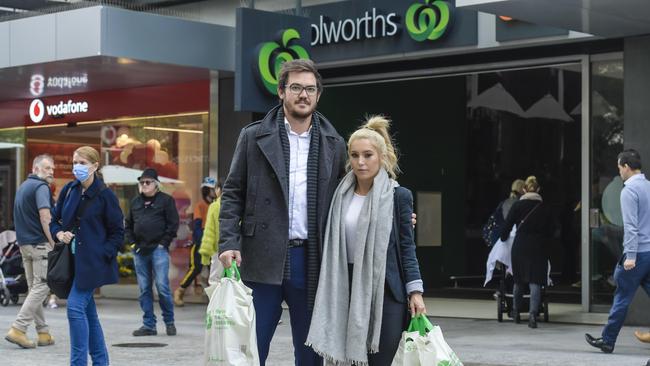 Jay Syse, 34, and Jesse Stapenell, 34, with their shopping in Rundle Mall. Picture: Roy VanDerVegt