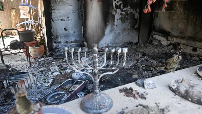 A Hanukkah menorah left on a bench of a destroyed house after Hamas attacked Kissufim kibbutz on October 7 last year. Picture: Getty