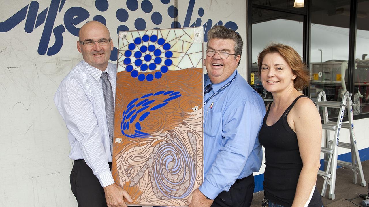 Toowoomba Arts Council's Splashing Back Art Trail has been selected as a finalist in two categories for the National Street Art Awards in 2020. Shane Stenhouse from Lifeline (left), Derek Tuffield CEO Lifeline DDSW (centre) and artist Maria Richardson artist with her Splashing Back mosaic piece back in 2013.