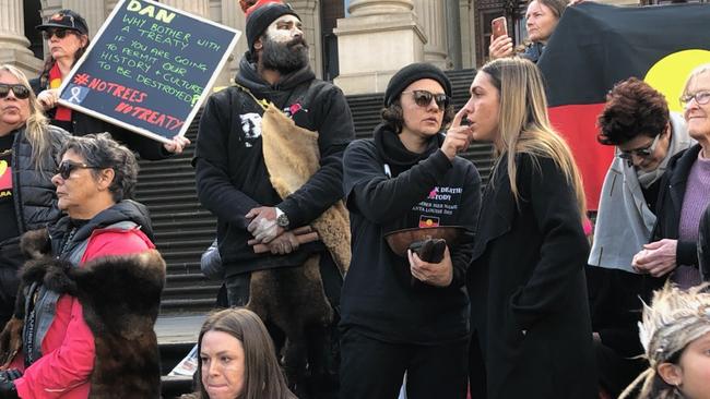 Protesters against the route of the Western Highway upgrade near Ararat gather at Parliament House in Victoria. Aboriginal people from the Djab Wurrung community say the route will remove culturally significant trees.