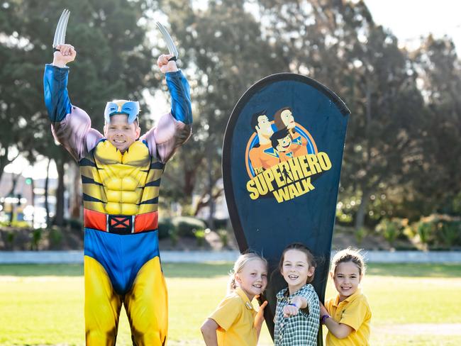 Tas Cassim with Maroubra Bay Public School pupils Indie Heron, 8, Frankie Gibson, 9, and Maeya Cassim, 9, at Heffron Park. Picture: Monique Harmer