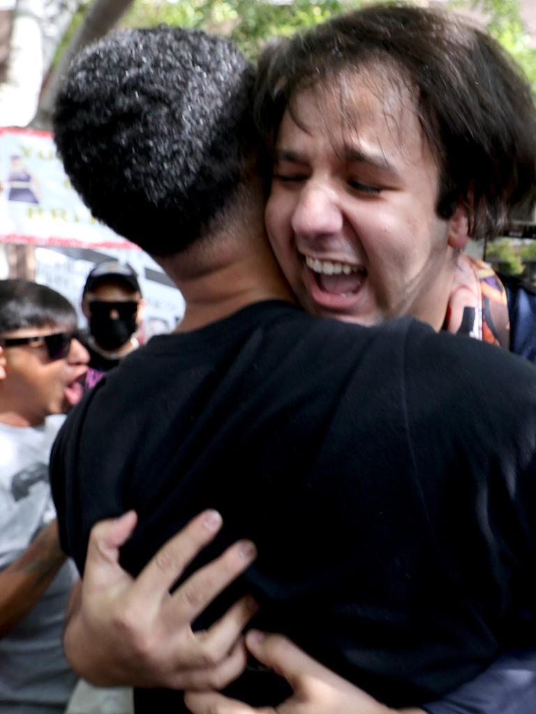 Emotional Britney fans embrace outside the court. Picture: Kevin Winter/Getty Images