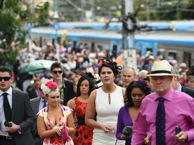 Thousands of race goers arrive at Flemington by train. Picture: Jake Nowakowski