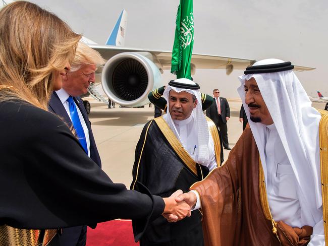 US First Lady Melania Trump (L) shakes hands with Saudi King Salman bin Abdulaziz al-Saud (R) upon arrival at King Khalid International Airport in Riyadh on May 20, 2017. Picture: Bandar Al-Jaloud