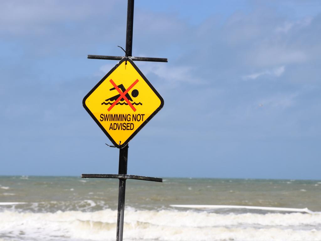 Surf Life Saving Queensland have taken the flags down at Four Mile Beach, Port Douglas to encourage social distancing to avoid the spread of COVID-19. Picture: Gizelle Ghidella