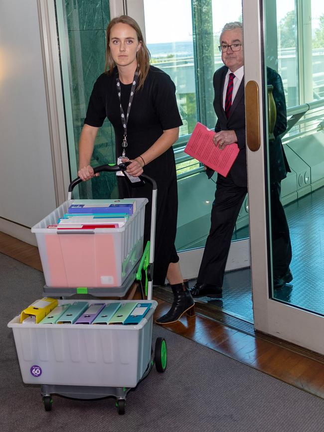 Andrew Wilkie, right, and a staffer, wheel Hillsong documents into parliament in March 2023. Picture: NewsWire