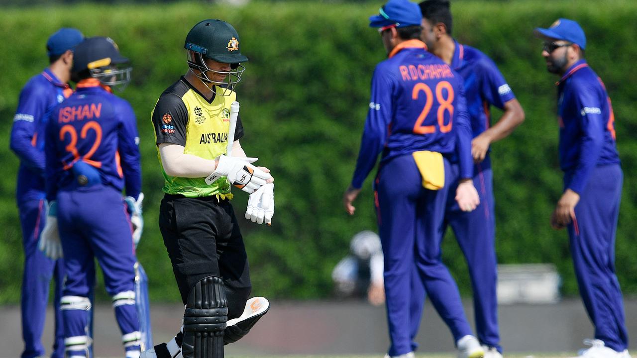 David Warner walks back to pavilion after his dismissal during a warmup match against India. Picture: Aamir Qureshi/AFP