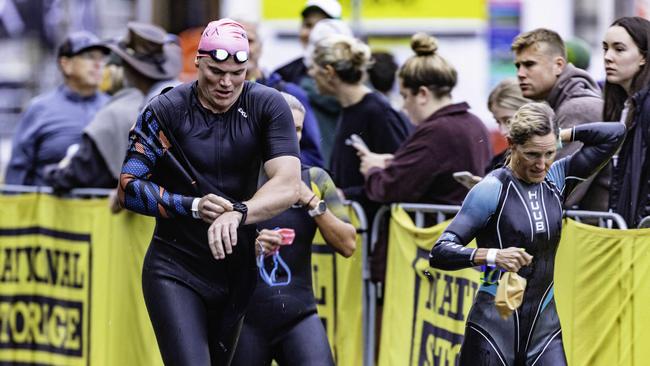Athletes return from the swimming leg of the Ironman 70.3 Tasmania in Hobart on Sunday 4th February. Picture: Linda Higginson