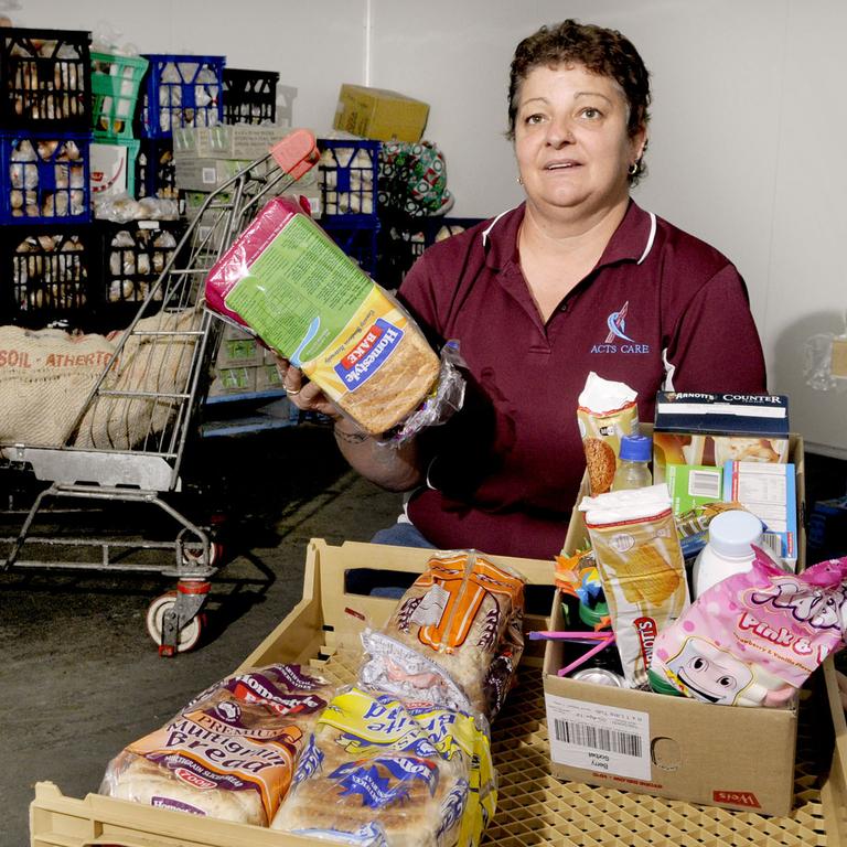 Daphne Raabe-Groves, Warehouse Manager Toowoomba Food Assist in 2011 with supplies. Photo Nev Madsen.