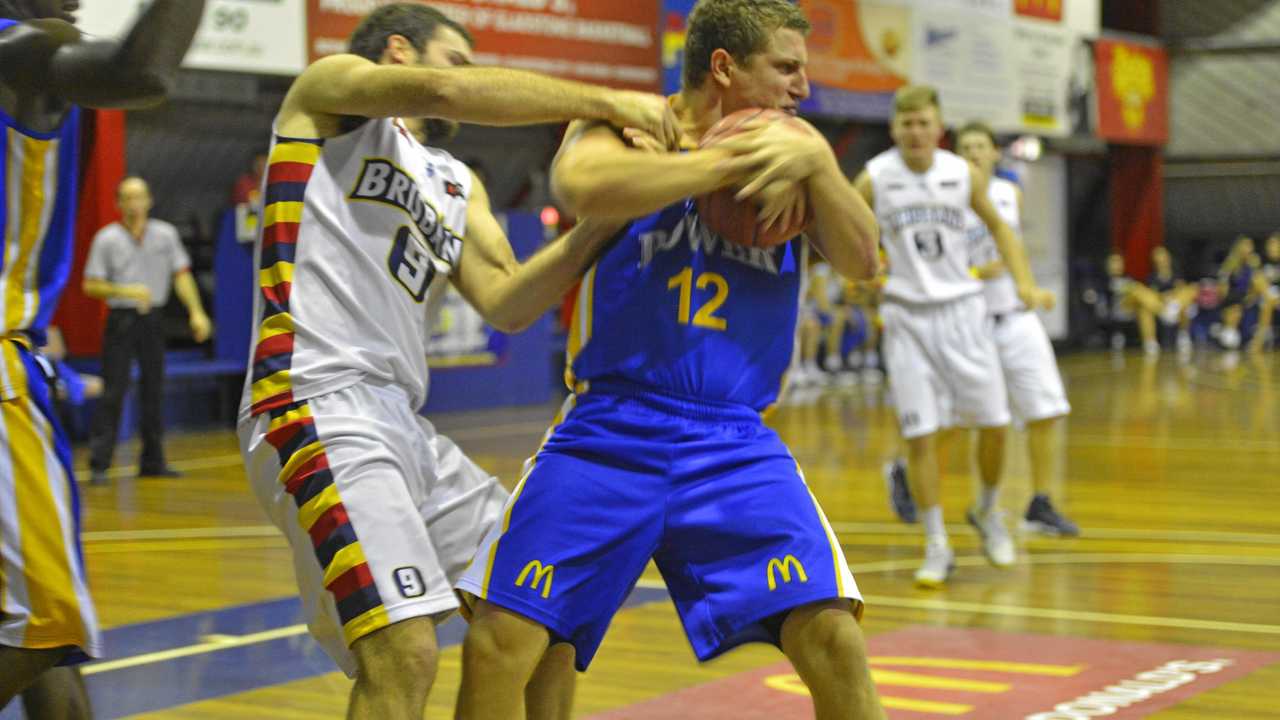 Troy Robinson wraps up a rebound in his 100th games for the Power in a match against Brisbane at Kev Broome Stadium.Photo Jake Jones / The Observer. Picture: Jake Jones