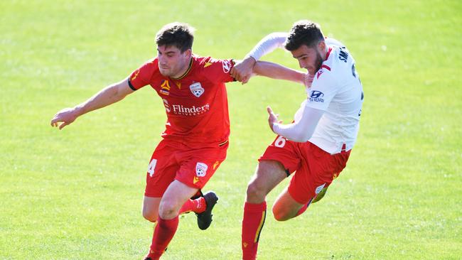 Adelaide United pair Ryan Strain and Noah Smith prepare for the A-League season resumption. Picture: AAP Image/David Mariuz