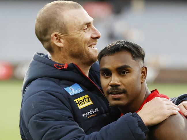 MELBOURNE, AUSTRALIA - MARCH 23: Simon Goodwin, Senior Coach of the Demons and Kysaiah Pickett of the Demons embrace after  the round two AFL match between Hawthorn Hawks and Melbourne Demons at Melbourne Cricket Ground, on March 23, 2024, in Melbourne, Australia. (Photo by Darrian Traynor/Getty Images)