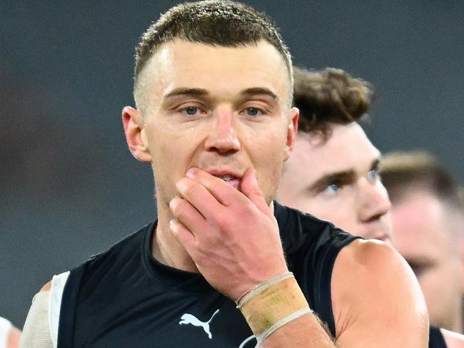 MELBOURNE, AUSTRALIA - JUNE 11: Patrick Cripps and Jacob Weitering and their Blues team mates look dejected after losing the round 13 AFL match between Carlton Blues and Essendon Bombers at Melbourne Cricket Ground, on June 11, 2023, in Melbourne, Australia. (Photo by Quinn Rooney/Getty Images)