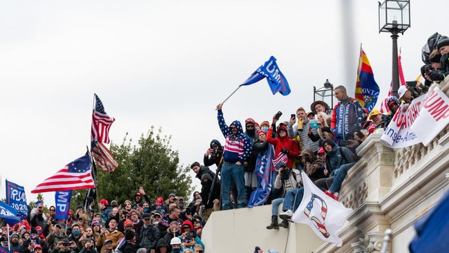 Demonstrators swarm the US Capitol building during a protest in Washington, D.C