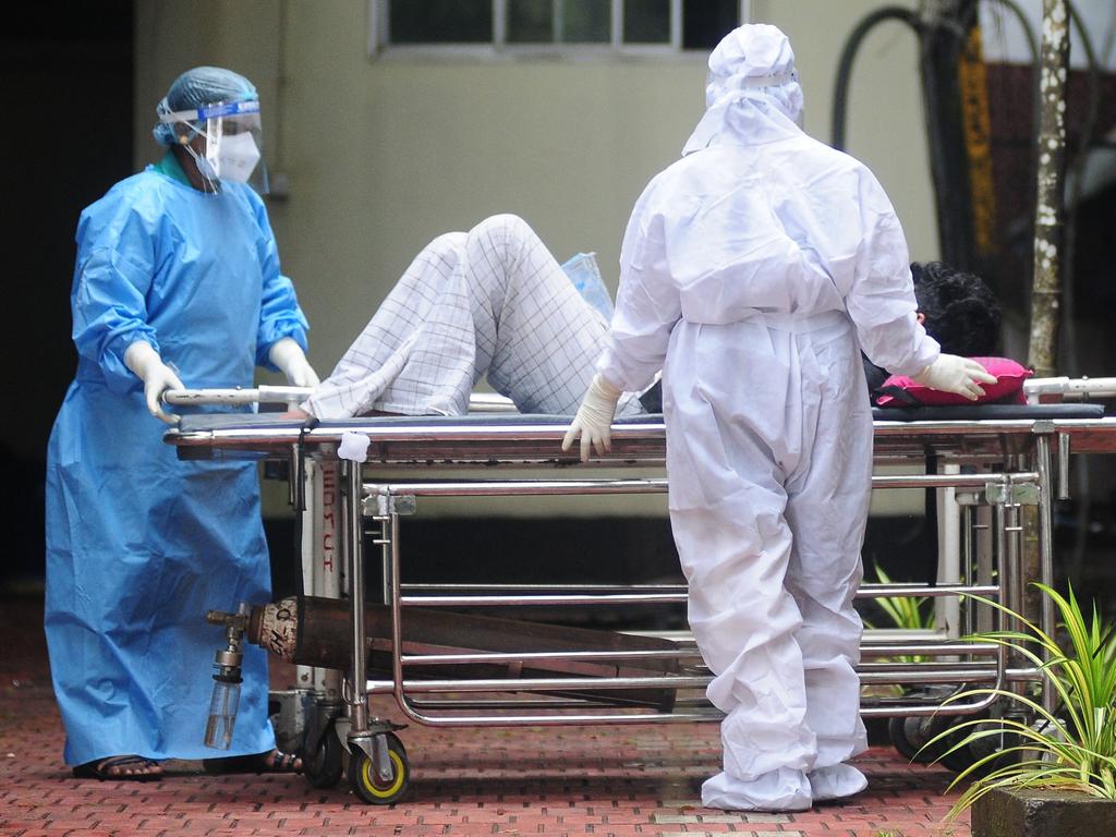 Health workers wearing protective gears shift a man with symptoms of Nipah virus to an isolation ward at a government hospital in the south Indian state of Kerala on September 16, 2023. Picture: AFP