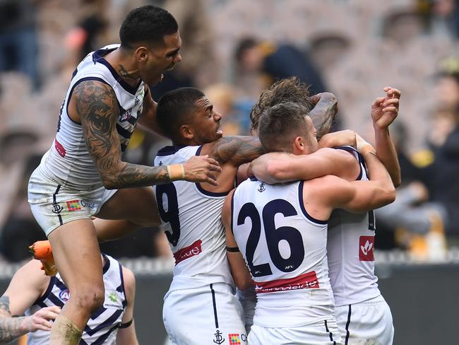 Dockers players react after David Mundy (right) kicked a goal after the siren to win the Round 8 AFL match between the Richmond Tigers and the Fremantle Dockers at the MCG in Melbourne, Sunday, May 14, 2017. (AAP Image/Julian Smith) NO ARCHIVING, EDITORIAL USE ONLY